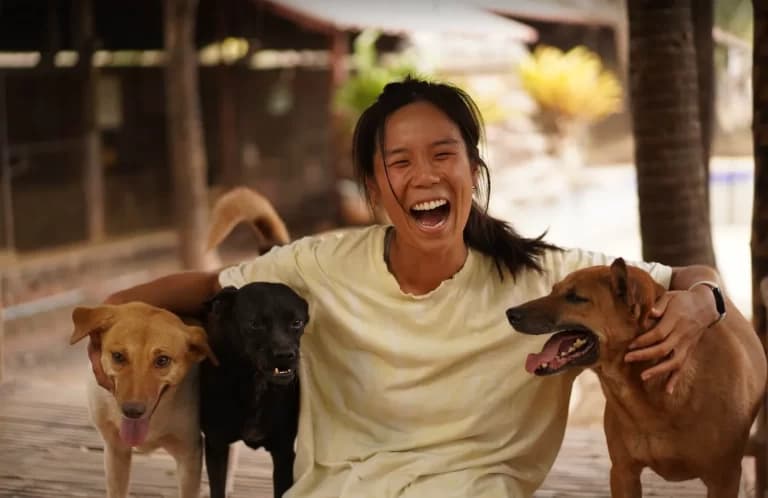 Caretaker with rescued dogs