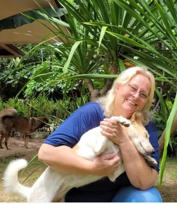 Gabriela Leonhard with a rescued dog at the sanctuary